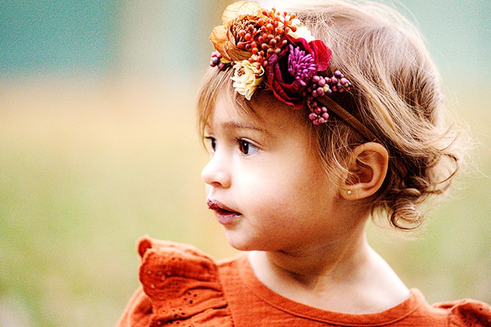 toddler girl red dress flower crown gazing far Princeton NJ autumn family portrait