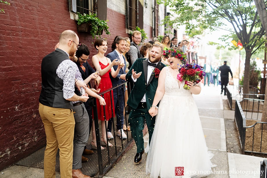 Radegast Hall Williamsburg Brooklyn NYC rad summer wedding bride and groom smiling happy cerebrated and cheered from friends and family on the street