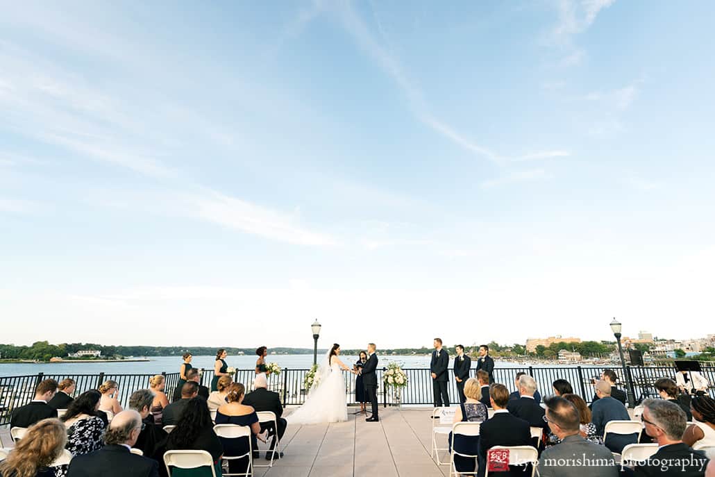 Molly Pitcher Inn Red Bank bride and groom bay ocean wedding ceremony holding hands