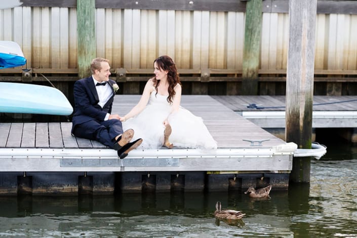 Molly Pitcher Inn Red Bank bride and groom wedding portrait on a dock with ducks