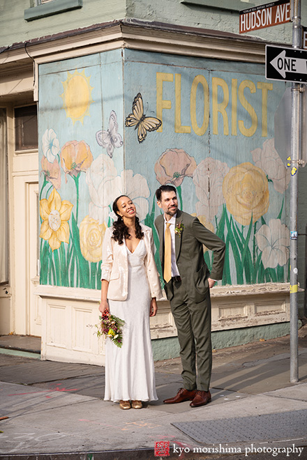 Vinegar Hill House, Dumbo Brooklyn, NYC, bride and groom, newlyweds outdoor portrait in front of flower and butterfly graffiti