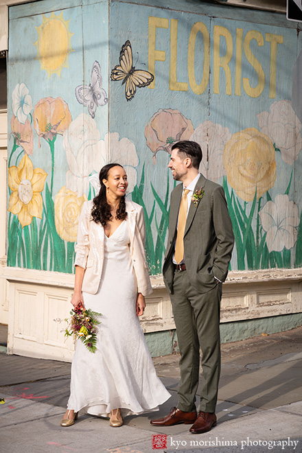 Vinegar Hill House, Dumbo Brooklyn, NYC, bride and groom, newlyweds outdoor portrait in front of flower and butterfly graffiti