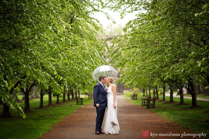 bride and groom, outdoor, portrait, restaurant, Princeton, NJ, wedding, rainy day, smiling, newlyweds, couple, umbrella kiss