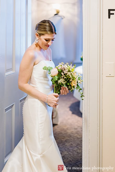Bride getting ready in her dress with bouquet at wedding at Princeton Prospect House & Garden NJ