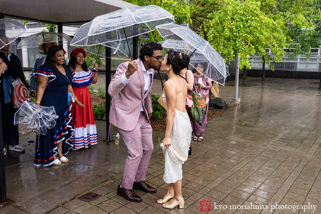 multiracial couple Brooklyn NYC wedding, Midnights Bar bride and groom first look street outdoor rain day umbrella North 5th Street Pier and Park