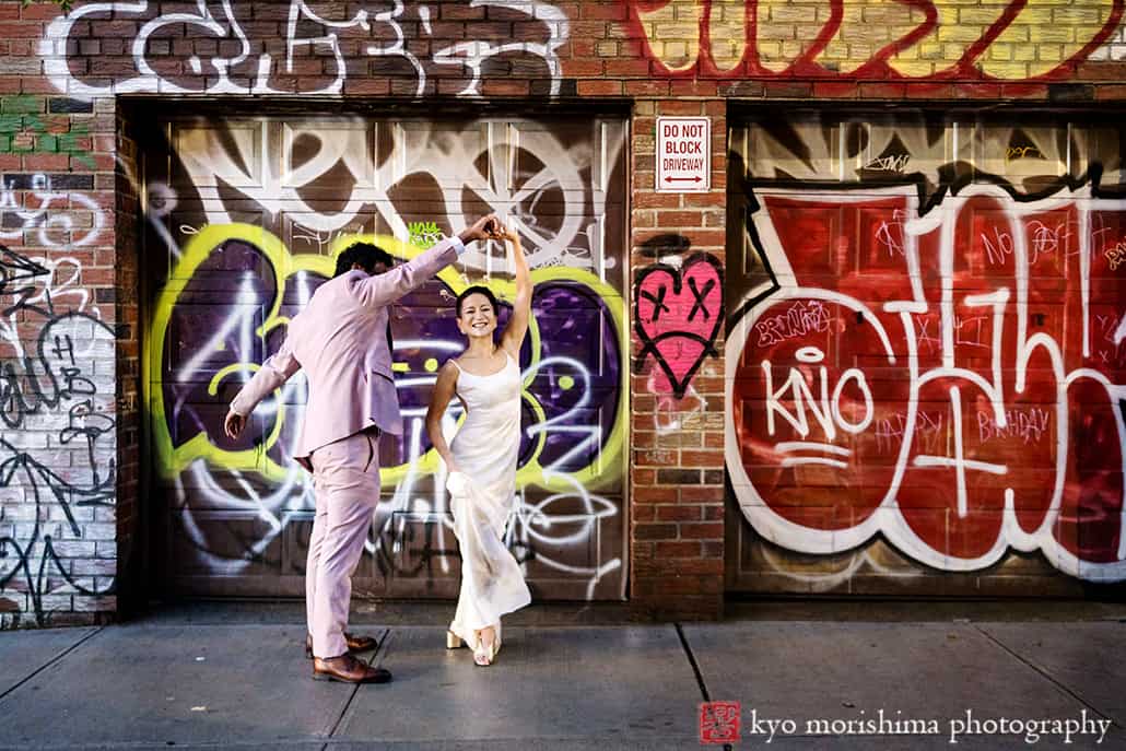 multiracial couple Brooklyn NYC wedding, Midnights Bar newlyweds street portrait night twirl