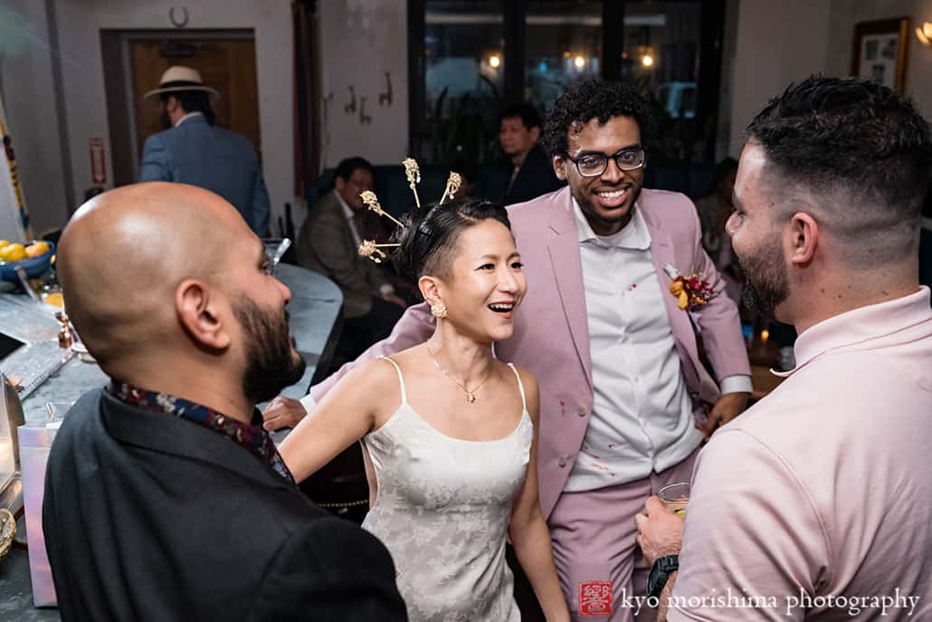 multiracial couple Brooklyn NYC wedding, Midnights Bar friends laughing