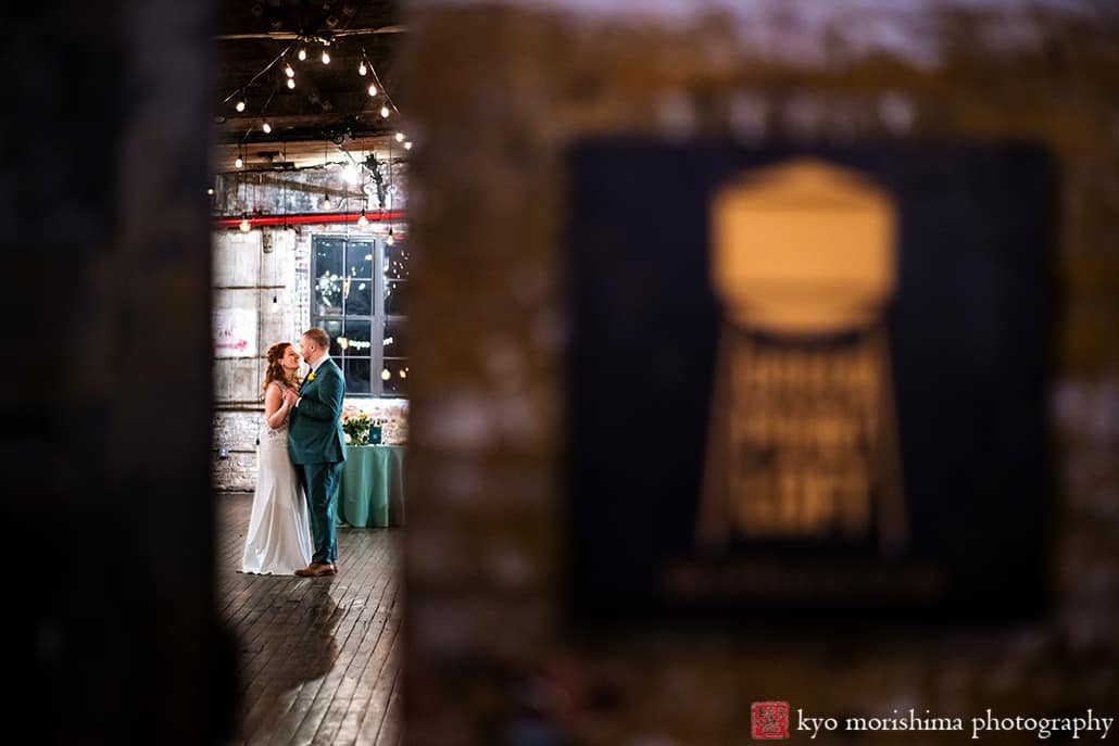 Greenpoint Loft Brooklyn, NYC, warehouse rustic wedding reception bride and groom newlyweds dance between doorway