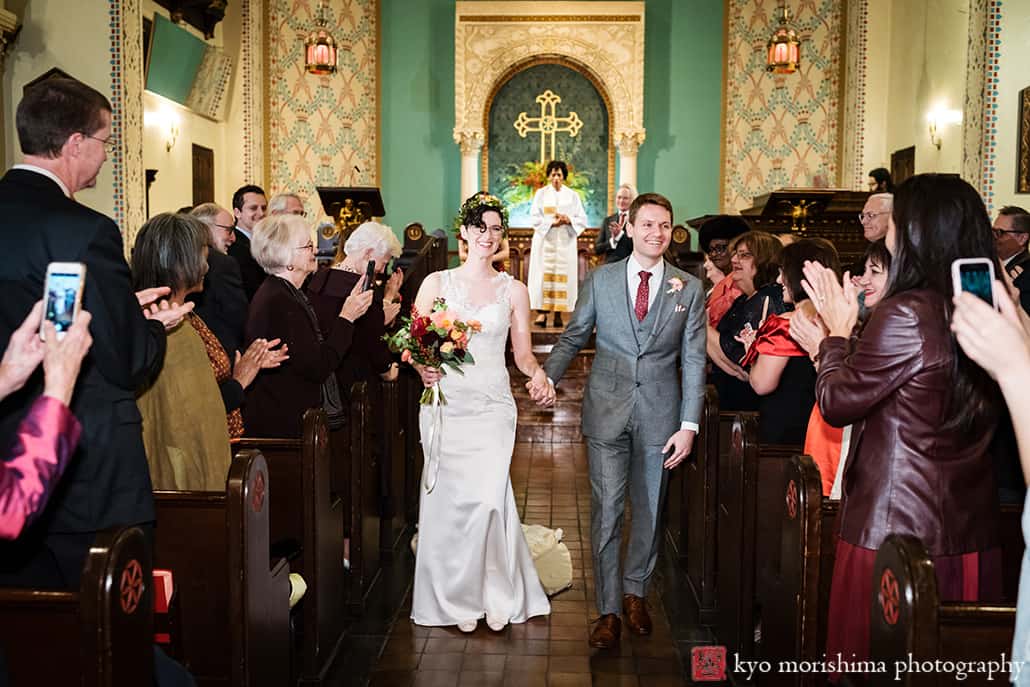 Park Avenue United Methodist Church wedding ceremony bride and groom fall autumn NYC Manhattan smiling walking down the aisle cheering by their guests family and friends