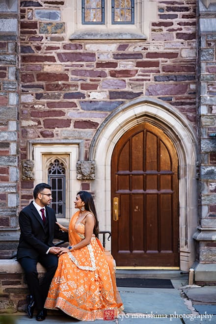 Princeton University Campus Rockefeller College NJ Indian engagement documentary canded portrait session fall autumn a couple saree dress European brick building wooded door old looking at each other
