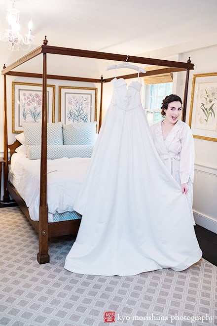 at Fall The Inn at Fernbrook Farm Chesterfield NJ Wedding bride showing off her dress excited smiling while getting ready in a bridal suite room