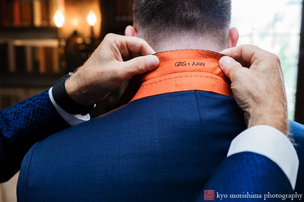 at Fall The Inn at Fernbrook Farm Chesterfield NJ Wedding groom father custom stitching of bride's name in his suit while getting ready in a suite room