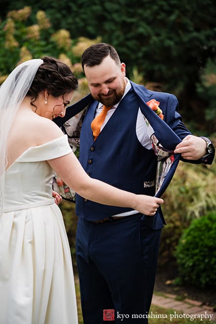at Fall The Inn at Fernbrook Farm Chesterfield NJ Wedding bride and groom checking grooms inside liner of his jacket custom tailored stitching after first look