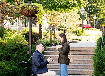 fall autumn Princeton Palmer Square NJ engagement proposal couple outdoor portrait photography session get down on his knees asking question proposing showing a ring