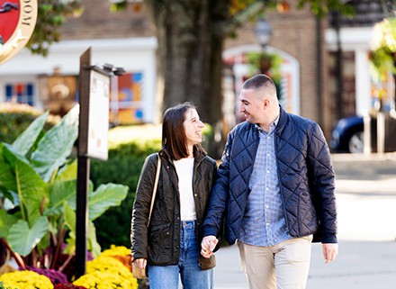 fall autumn Princeton Palmer Square NJ engagement proposal couple outdoor portrait photography session talking a walk holding hands