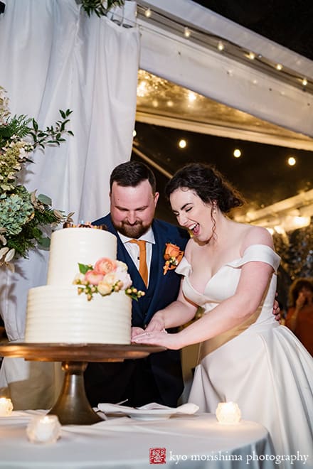 Fall The Inn at Fernbrook Farm Chesterfield NJ tent wedding string lights reception bride and groom cutting cake