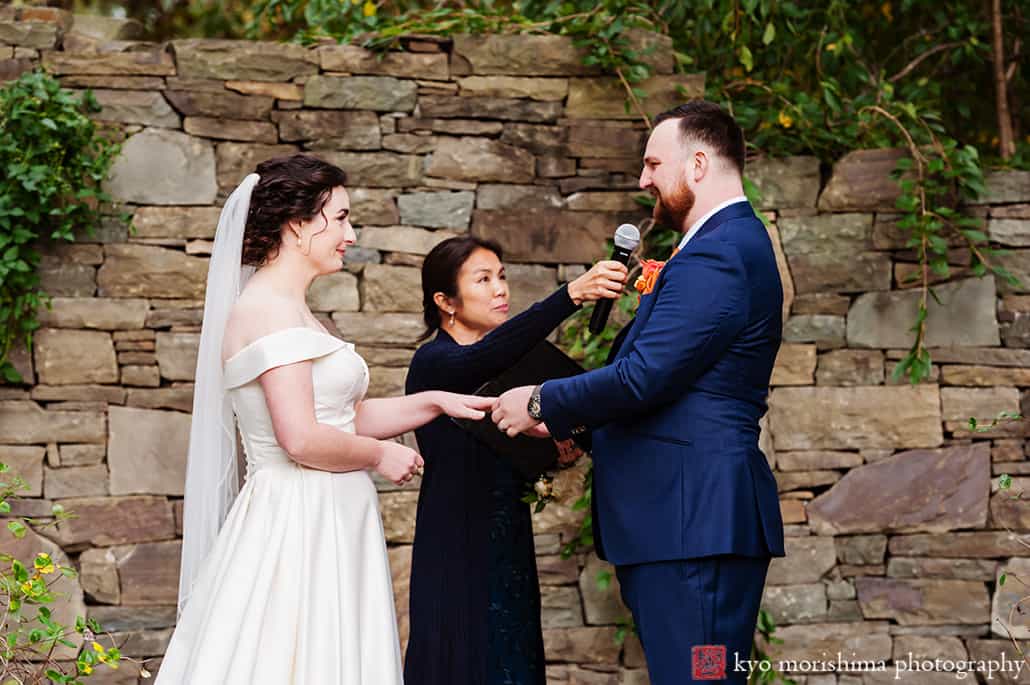 Fall The Inn at Fernbrook Farm Chesterfield NJ Wedding ceremony groom putting wedding ring on bride's hand