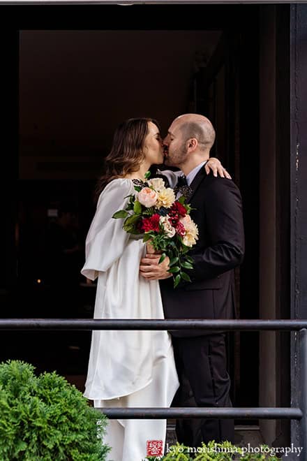 bride and groom outdoor street portrait wedding Bottino restaurant Chelsea Manhattan NYC kiss