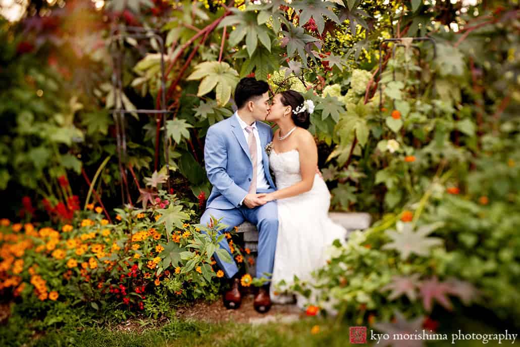 Multi cultural documentary wedding portrait bride and groom newlyweds at Queens Botanical Garden NYC fall wedding kiss by Kyo Morishima Photogrpahy