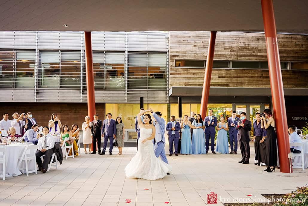 Bride and groom newlywed first dance twirl at Queens Botanical Garden NYC fall wedding reception by Kyo Morishima Photogrpahy