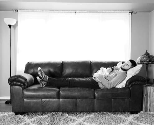 NYC Brooklyn NJ Princeton newborn family portrait dad baby sleeping napping on couch black and white