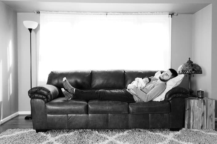 NYC Brooklyn NJ Princeton newborn family portrait dad baby sleeping napping on couch black and white