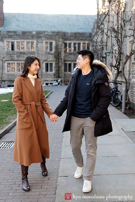 winter snow proposal portrait Princeton University NJ NYC couple taking a walk holding hands smiling