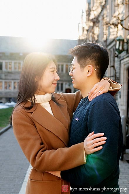 winter snow proposal engagement outdoor portrait Princeton University NJ NYC couple hugging and smiling