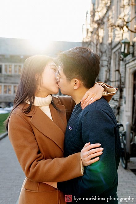 winter snow proposal engagement outdoor portrait Princeton University NJ NYC couple hugging and kissing