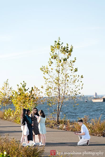 Scavenger Hunt proposal engagement couple portrait Bush Terminal Piers Park Brooklyn NYC down on his knee