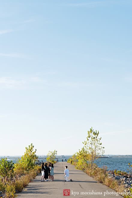 Scavenger Hunt proposal engagement couple portrait Bush Terminal Piers Park Brooklyn NYC down on his knee