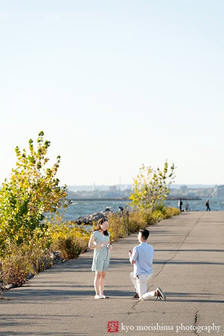 Scavenger Hunt proposal engagement couple portrait Bush Terminal Piers Park Brooklyn NYC down on his knee