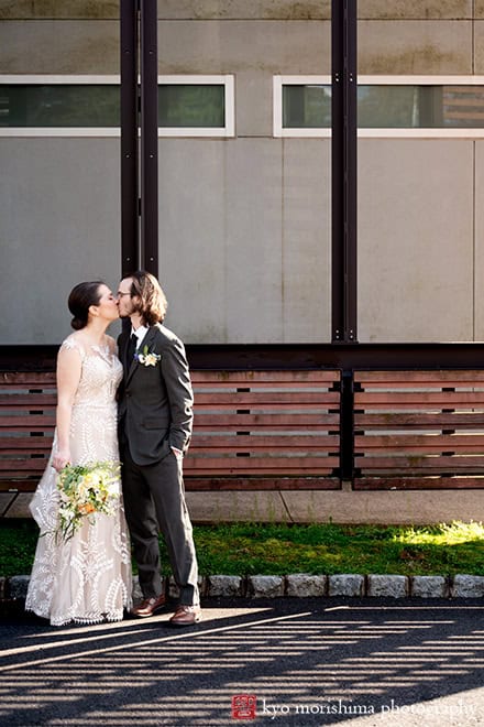 Spring Morris Museum Wedding with Potted Plants Morristown NJ bride groom outdoor portrait kiss