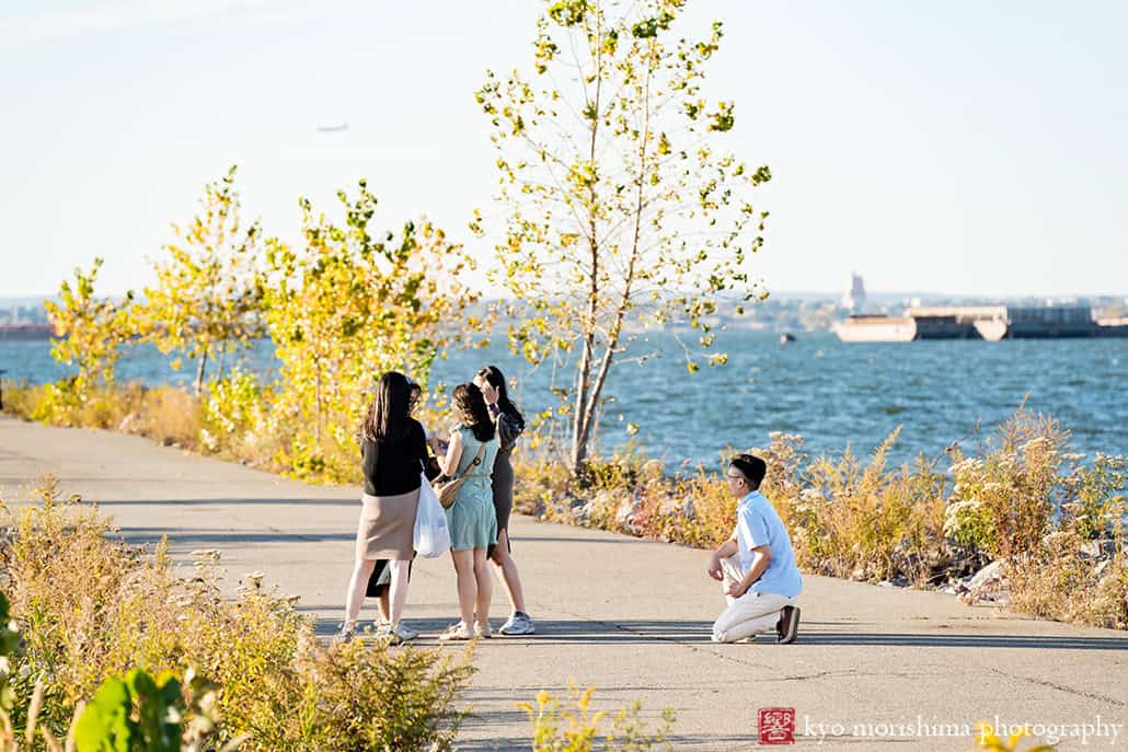 Scavenger Hunt proposal engagement couple portrait Bush Terminal Piers Park Brooklyn NYC down on his knee