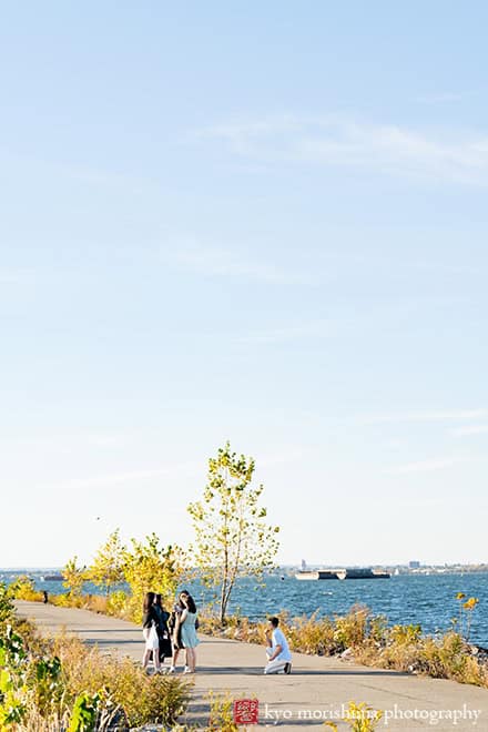 Scavenger Hunt proposal engagement couple portrait Bush Terminal Piers Park Brooklyn NYC down on his knee