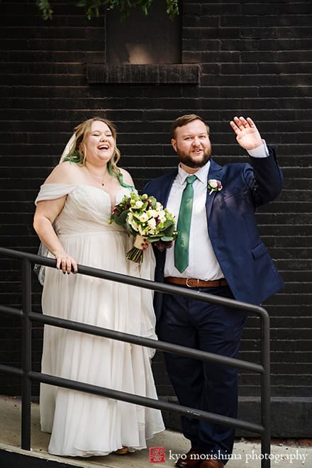 501 Union Gowanus canal Brooklyn documentary street life style wedding portrait bride and groom together smiling waiving