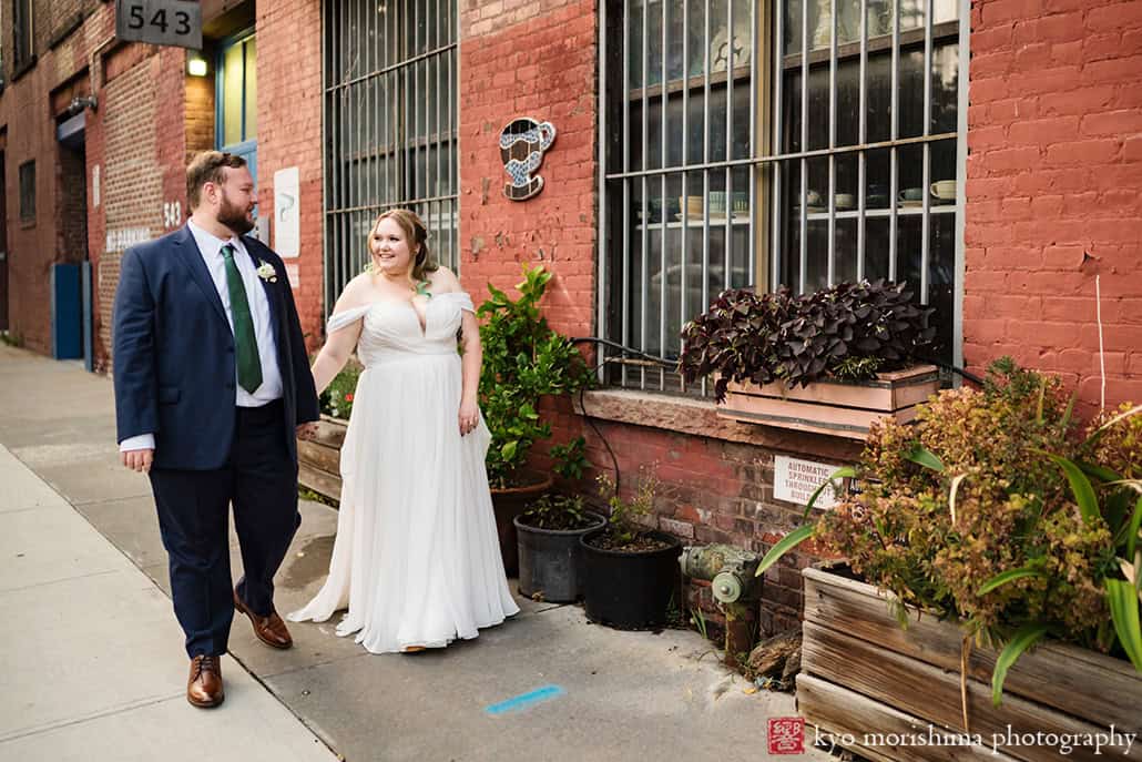 501 Union Gowanus canal Brooklyn documentary street life style wedding portrait bride and groom holding hands walking