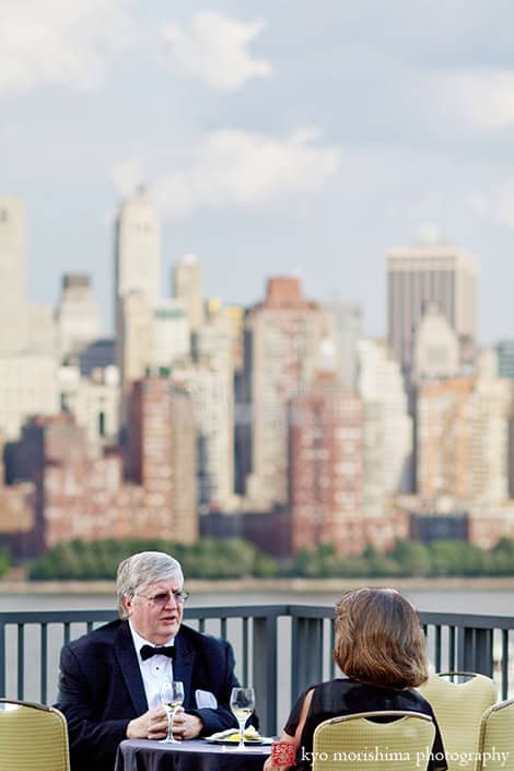 Hyatt Regency Jersey City on the Hudson NJ Guests Enjoying Manhattan Skyscrapers View Outdise Balcony