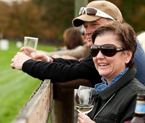 Corporate Event Far Hills Race Meeting NJ luncheon Guests Food Company Catering Looking at Horses Smiling