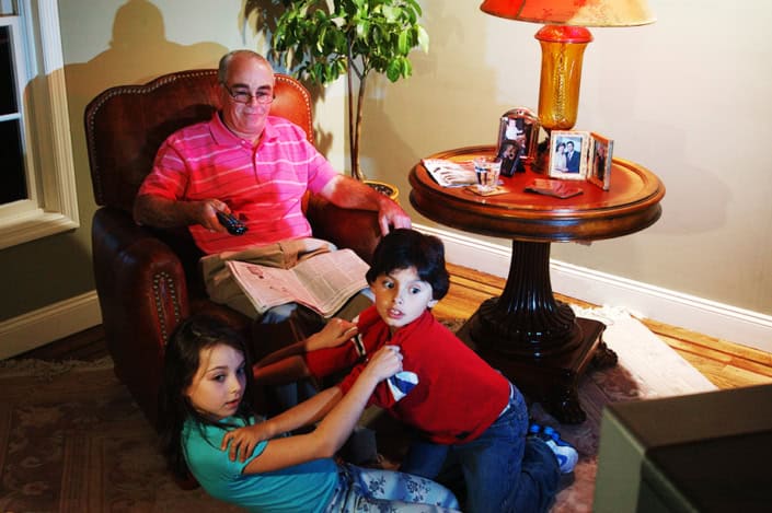 Grandpa and grand children watching tv fighting for channels for Cable TV commercial ads Manhattan NYC