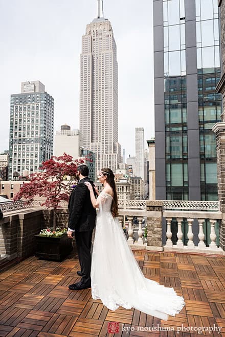Bride and groom outdoor first look with Empire State Building at Midtown Loft & Terrac, Manhattan NYC rooftop wedding event venue