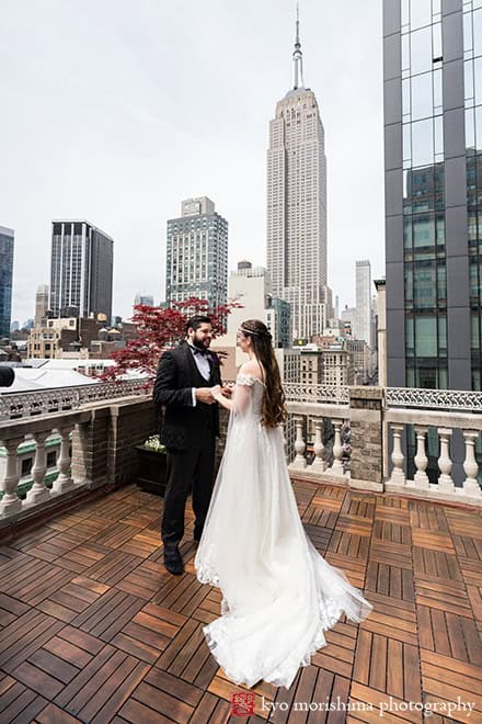 Bride and groom outdoor first look with Empire State Building at Midtown Loft & Terrac, Manhattan NYC rooftop wedding event venue