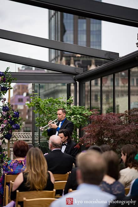 Bride and groom Outdoor ceremony Midtown Loft & Terrac, Manhattan NYC rooftop wedding trumpet instrument