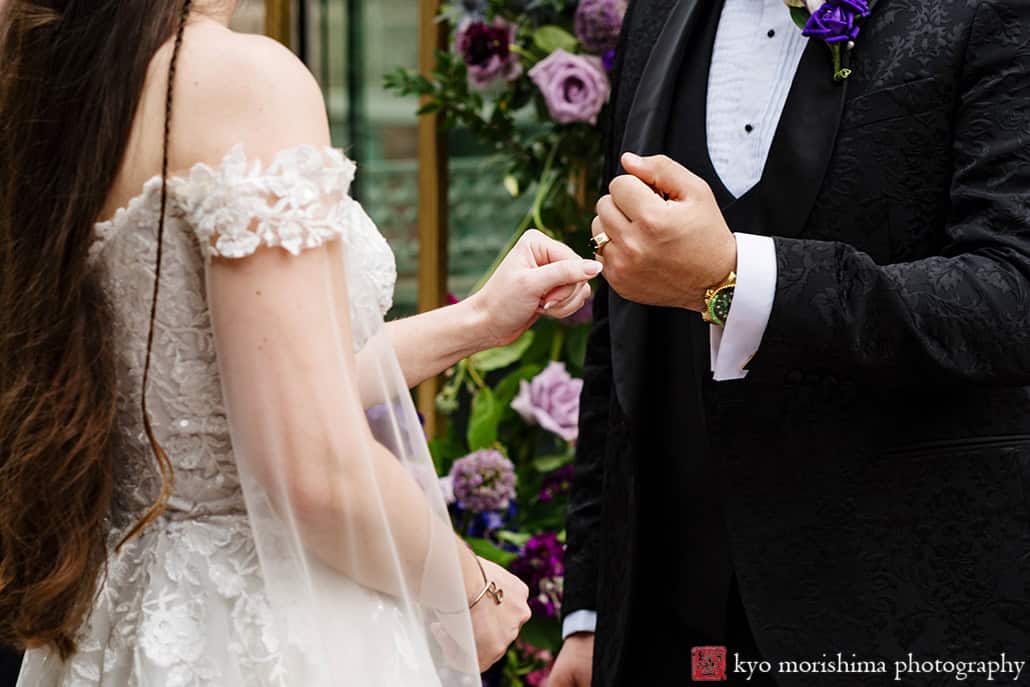 Bride and groom Outdoor ceremony Midtown Loft & Terrace, Manhattan NYC rooftop wedding exchanging rings
