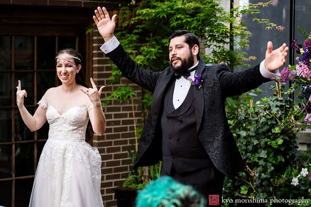 Bride and groom having fun Outdoor reception Midtown Loft & Terrace, Manhattan NYC rooftop wedding