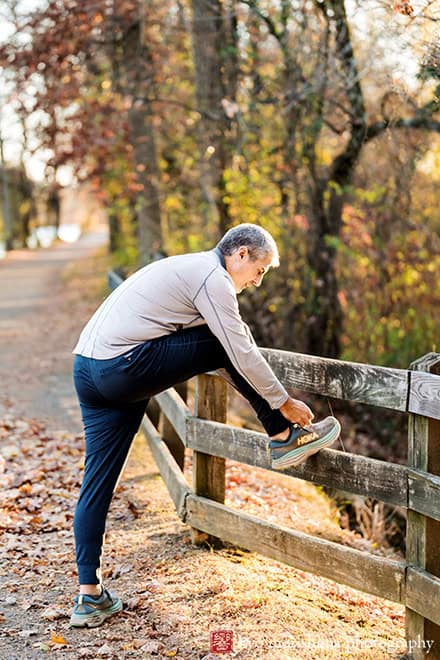 Branding business owner solopreneur entrepreneur Brooklyn NYC Manhattan Palmer Square Princeton NJ lifestyle athletic exercises portrait streching with fall foliage