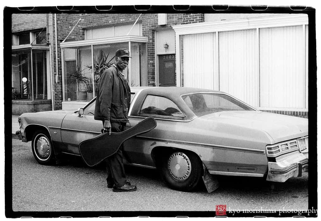 street photography decisive moment, black and white, film, snow day, Washington DC Mr. O'Neill Washington DC Blues Musician