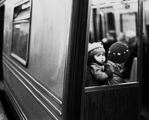 Baby on Parent’s Back in the NYC Subway