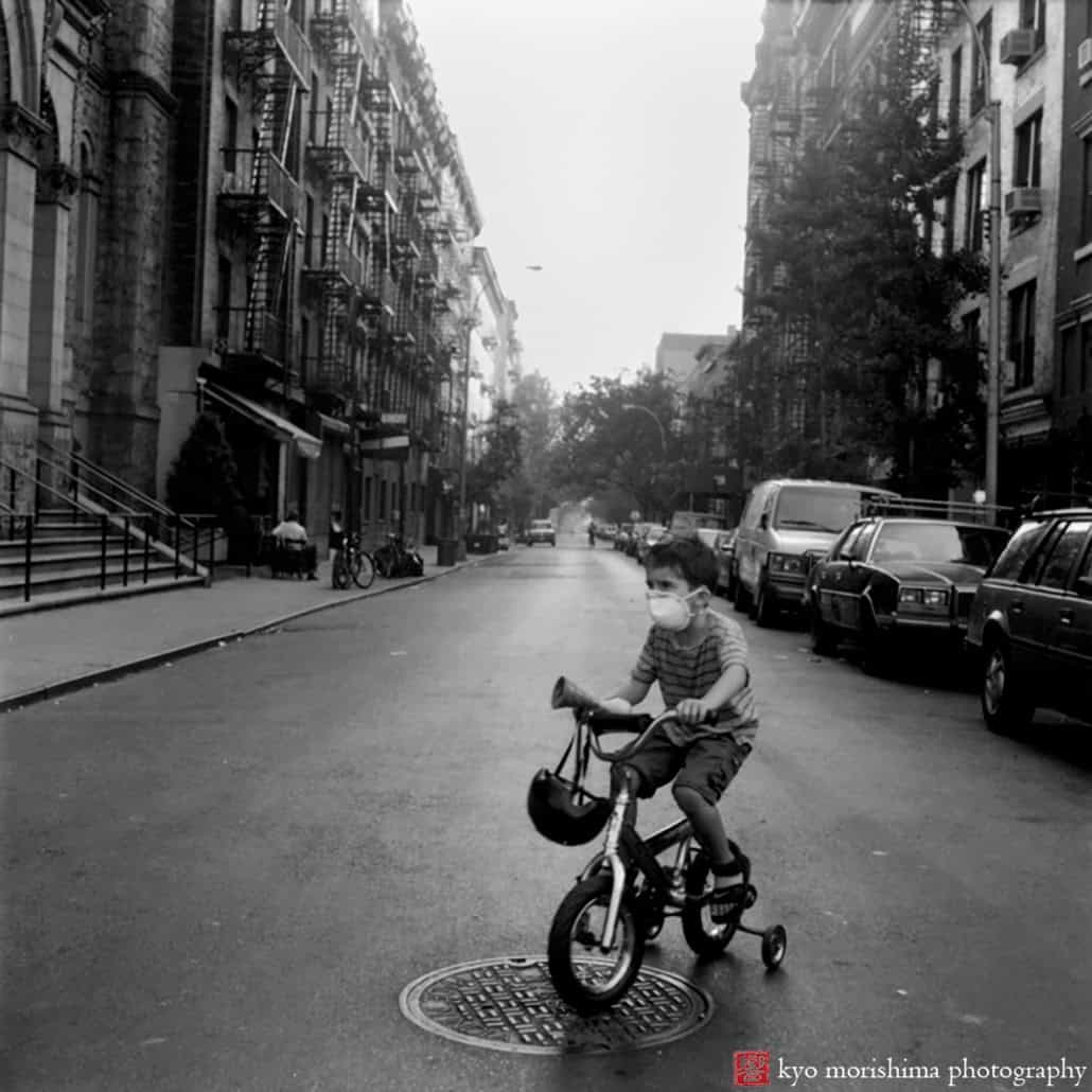 Kid riding tricycle after 9/11 in Soho NYC