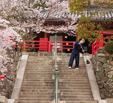 Monk Sweeping Temple Steps, Japan